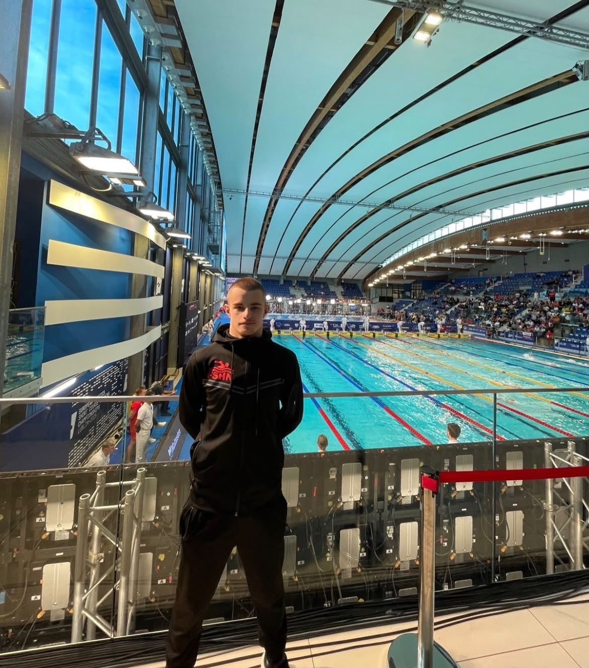 Klint Hoxha overlooking the competition pool at the European Short Course Swimming Championships, Lublin